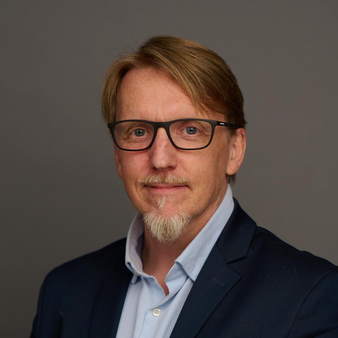 Porträttbild på en man.