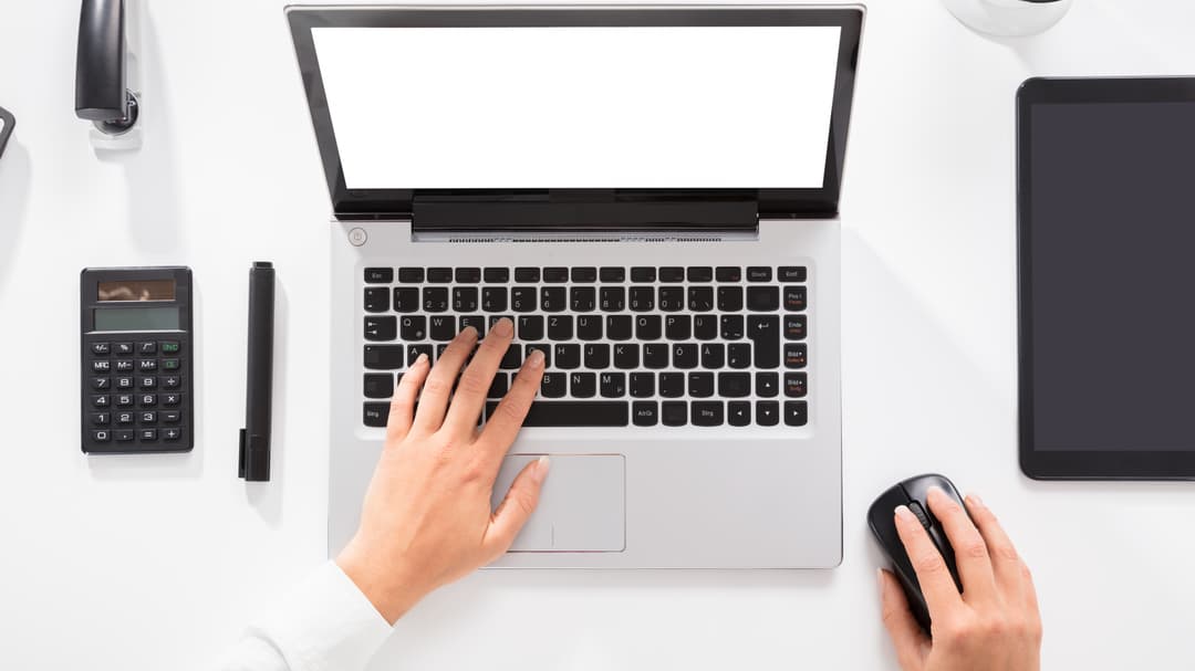 20566349-close-up-of-a-woman-working-on-laptop.jpg