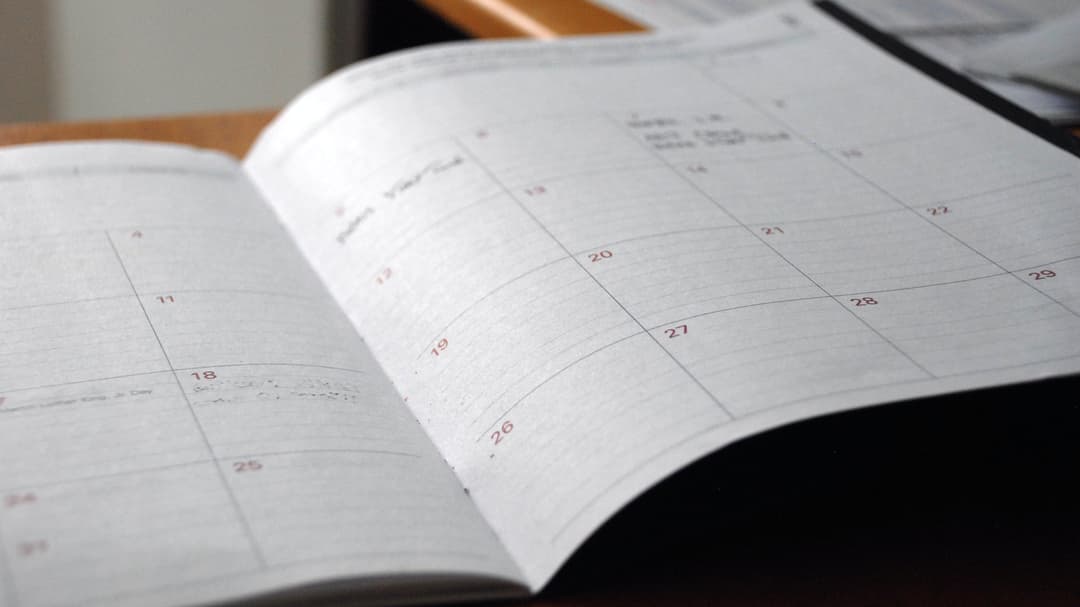 A planner lying open on a table