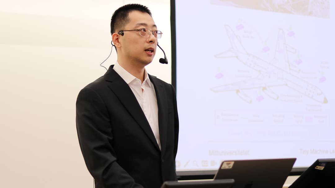 Yuxuan Zhang presents his work