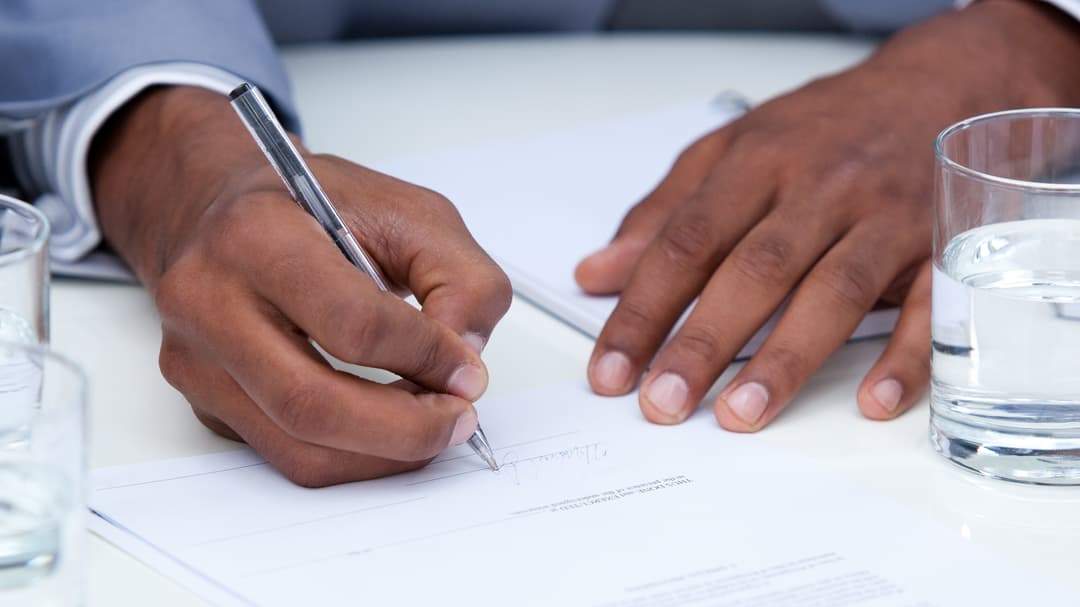 3672282-close-up-of-ambitious-business-man-signing-a-contract.jpg