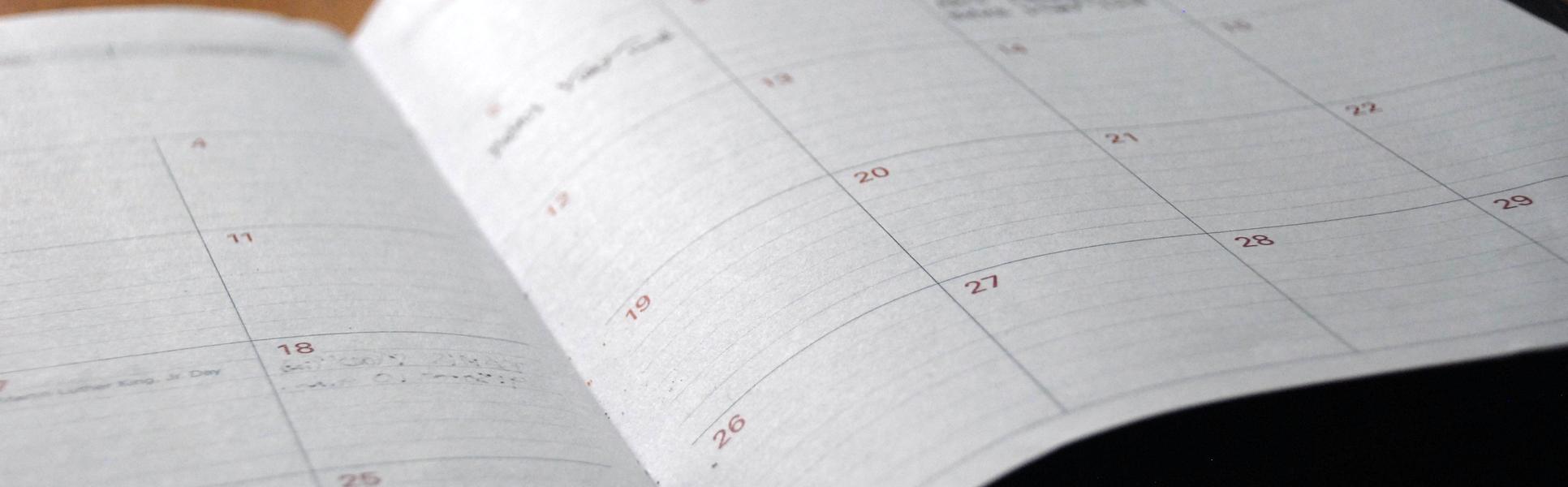 A planner lying open on a table