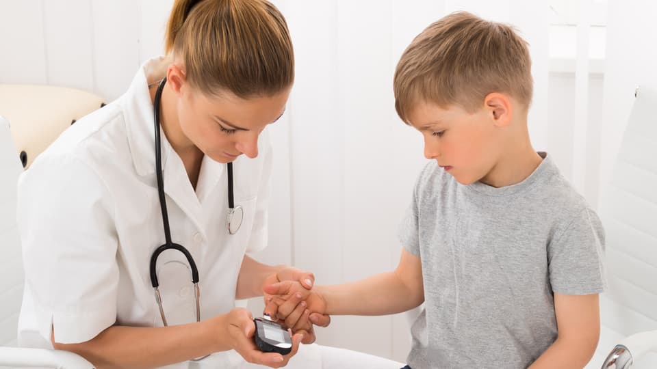 16561496-doctor-examining-blood-sugar-of-little-boy.jpg
