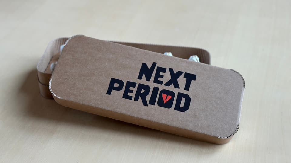 Grå ask med texten "Next period"